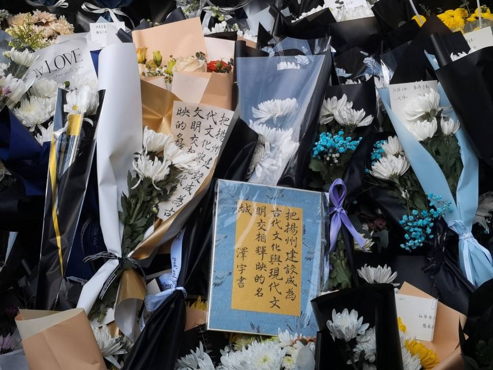 Bouquets of flowers are seen outside a former residence of former Chinese President Jiang Zemin, in Yangzhou, Jiangsu province, China December 1, 2022. — Handout via Reuters