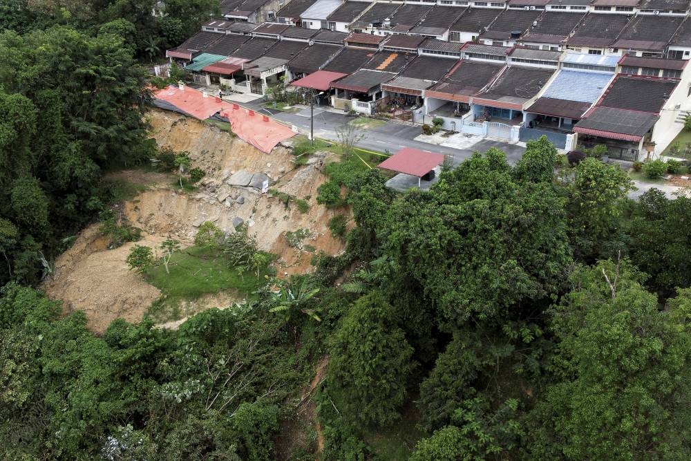An aerial view of the landslide area at Jalan Bukit Berlian 5, Taman Bukit Berlian, Lobak which was declared a disaster area, December 2, 2022. — Bernama pic