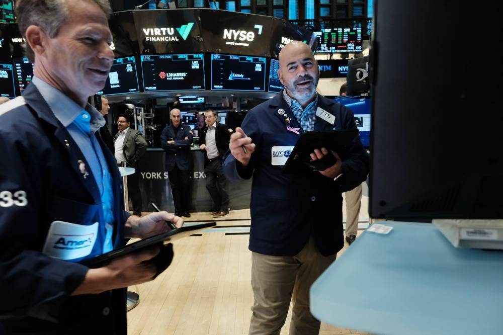 The Dow Jones Industrial Average rose 34.87 points, or 0.1 per cent, to 34,429.88, the S&P 500 fell 4.87 points to 4,071.7 and the Nasdaq Composite dropped 20.95 points, or 0.18 per cent, to 11,461.50. — Reuters pic