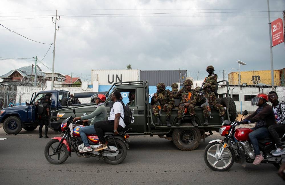 Members of Kenya Defence Forces (KDF), part of the troops to the East Africa Community Regional Force (EACRF) patrol as resident protest the deployment of a regional force which they see as ineffective in tackling the resurgent rebel group in North Kivu following renewed tensions around Goma in the North Kivu province of the Democratic Republic of Congo December 1, 2022. — Reuters pic