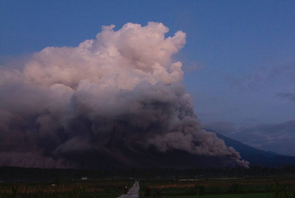 Mount Semeru spews smoke and ash in Lumajang on December 4, 2022. — AFP pic