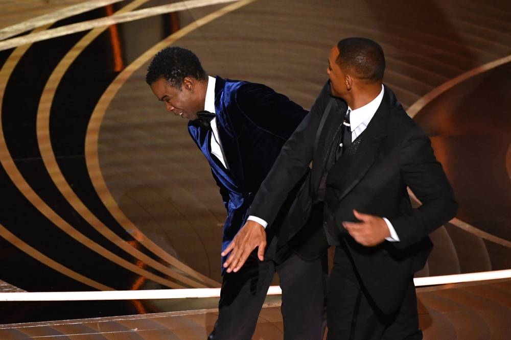 In this file photo taken on March 27, 2022, US actor Will Smith (right) slaps comedian Chris Rock onstage during the 94th Oscars at the Dolby Theatre in Hollywood, California. ― AFP pic