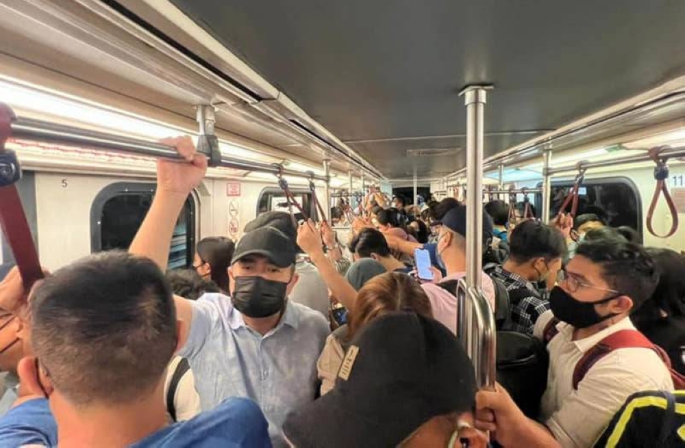 Transport Minister Anthony Loke goes incognito as he takes the Kelana Jaya LRT line during peak hours for a spot-check, December 5, 2022. — Picture from Facebook/Anthony Loke Siew Fook