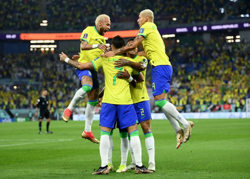 Brazil's Vinicius Junior celebrates with teammates after scoring the first goal against South Korea December 5, 2022. ― Reuters pic