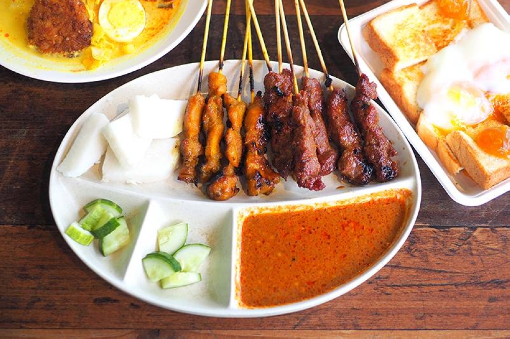 Order the 'satay' set that lets you try the chicken and beef 'satay' with 'nasi impit' and peanut sauce