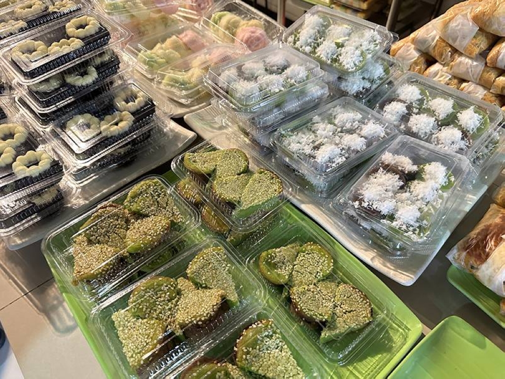 You will be tempted by the spread of 'kuih' when you queue to order your food