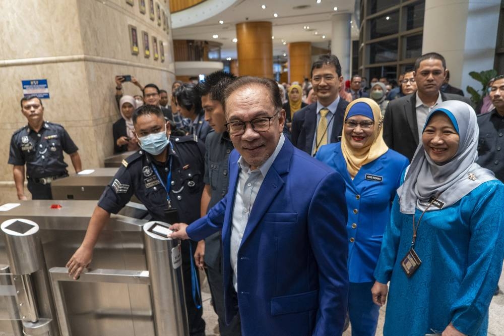 Prime Minister Datuk Seri Anwar Ibrahim, who is also finance minister, arrives at the Ministry of Finance in Putrajaya December 6, 2022. — Picture Shafwan Zaidon