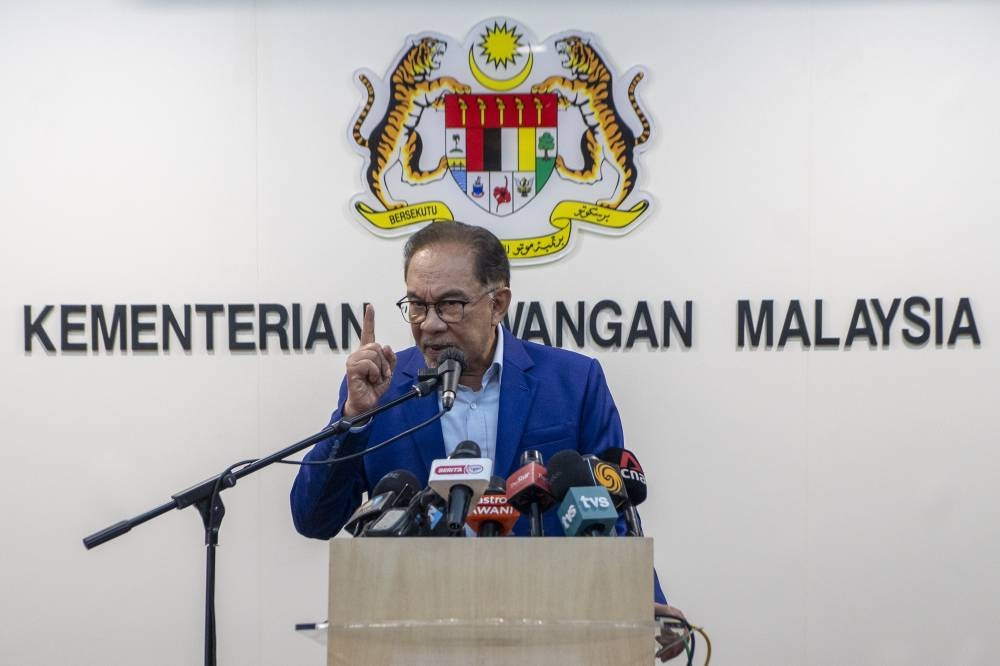 Finance minister, Datuk Seri Anwar Ibrahim speaks during a press conference at Ministry of Finance in Putrajaya December 6, 2022. — Picture Shafwan Zaidon