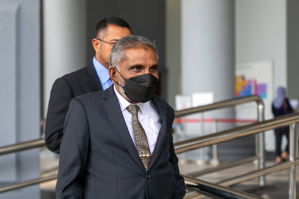 Tan Sri Dr Mohd Irwan Serigar bin Abdullah leaves the Kuala Lumpur High Court during lunch break November 24,2022. — Picture by Raymond Manuel