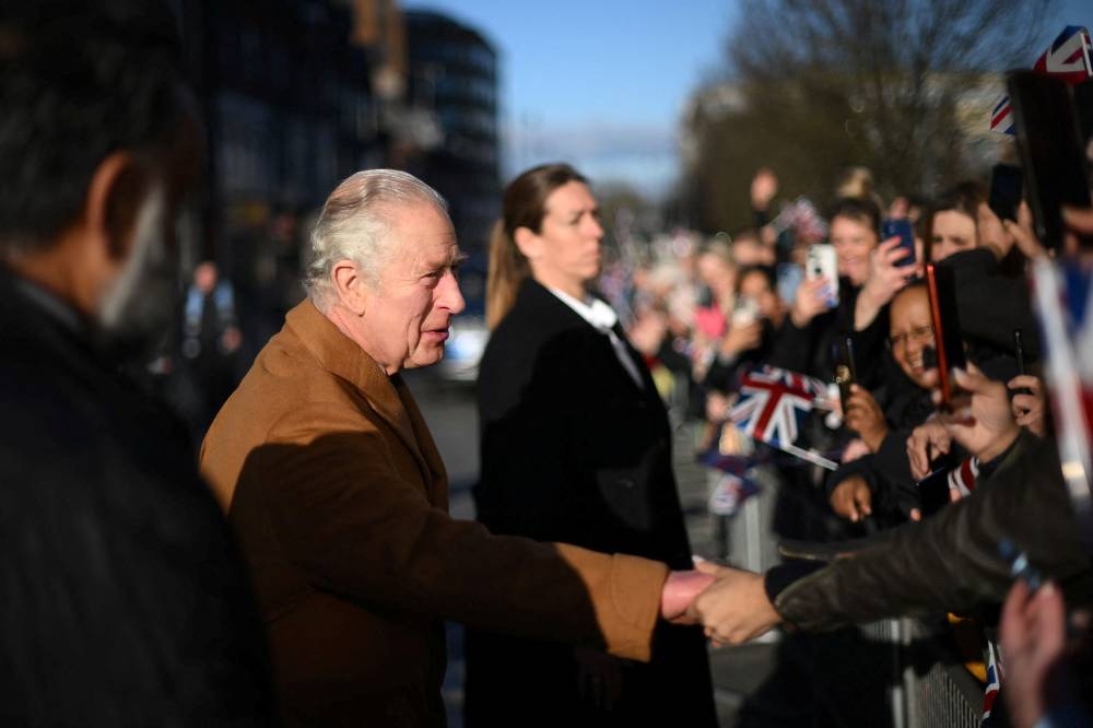 Britain’s King Charles greets members of the public as he visits Luton Town Hall in Luton, north of London, Britain December 6, 2022. — Reuters pic 