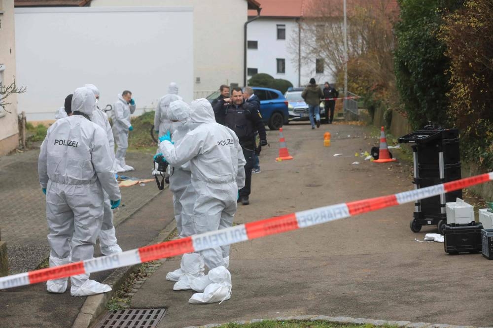 Police investigate a crime scene on November 5, 2022 in Illerkirchberg, southern Germany, after a the fatal stabbing of a 14-year-old girl on her way to school. — AFP pic