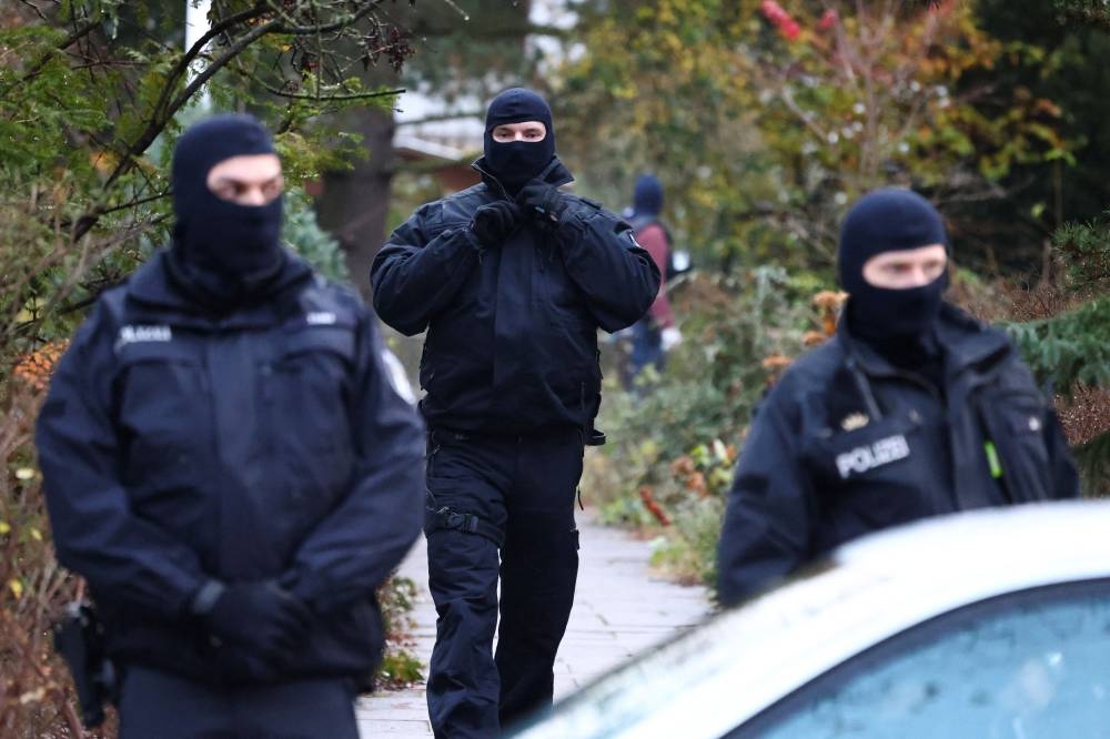 Police secure the area after 25 suspected members and supporters of a far-right group were detained during raids across Germany, in Berlin, Germany December 7, 2022. — Reuters pic 