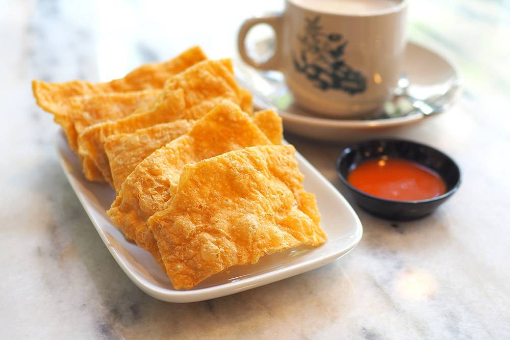 Nibble on crispy, fluffy fried 'fu pei' with your bowl of noodles.