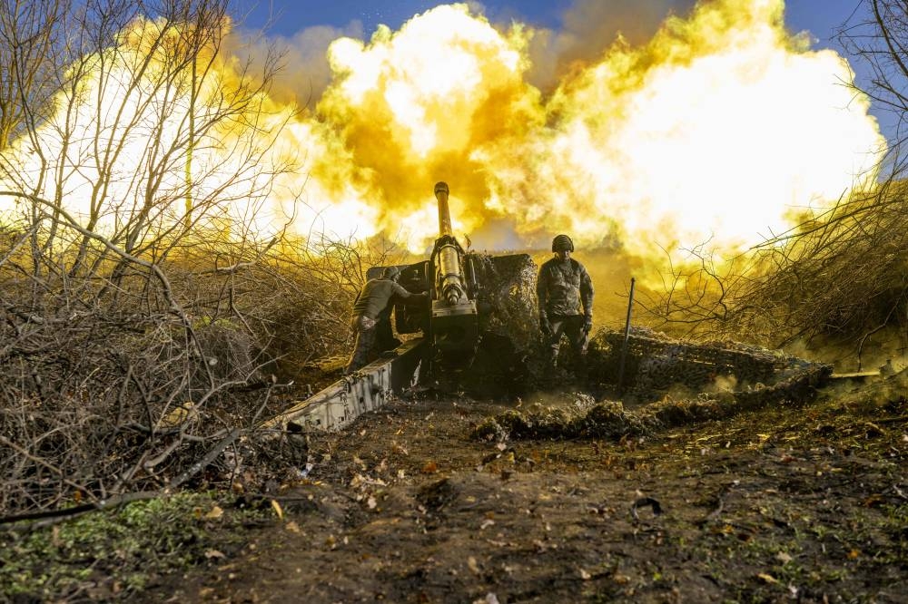 A Ukrainian soldier of an artillery unit fires towards Russian positions outside Bakhmut on November 8, 2022, amid the Russian invasion of Ukraine. — AFP pic 