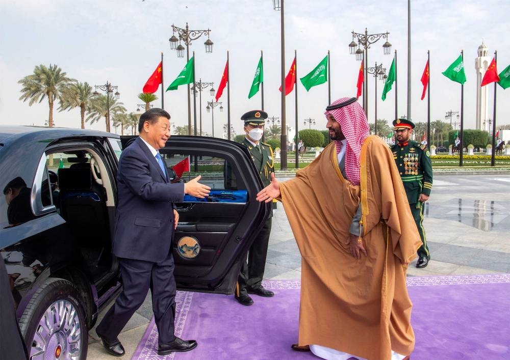 This handout picture provided by the Saudi Royal Palace shows Saudi Crown Prince Mohammed bin Salman welcoming Chinese President Xi Jinping in the capital Riyadh, on December 8, 2022. — Bandar al-Jaloud/Saudi Royal Palace/AFP pic