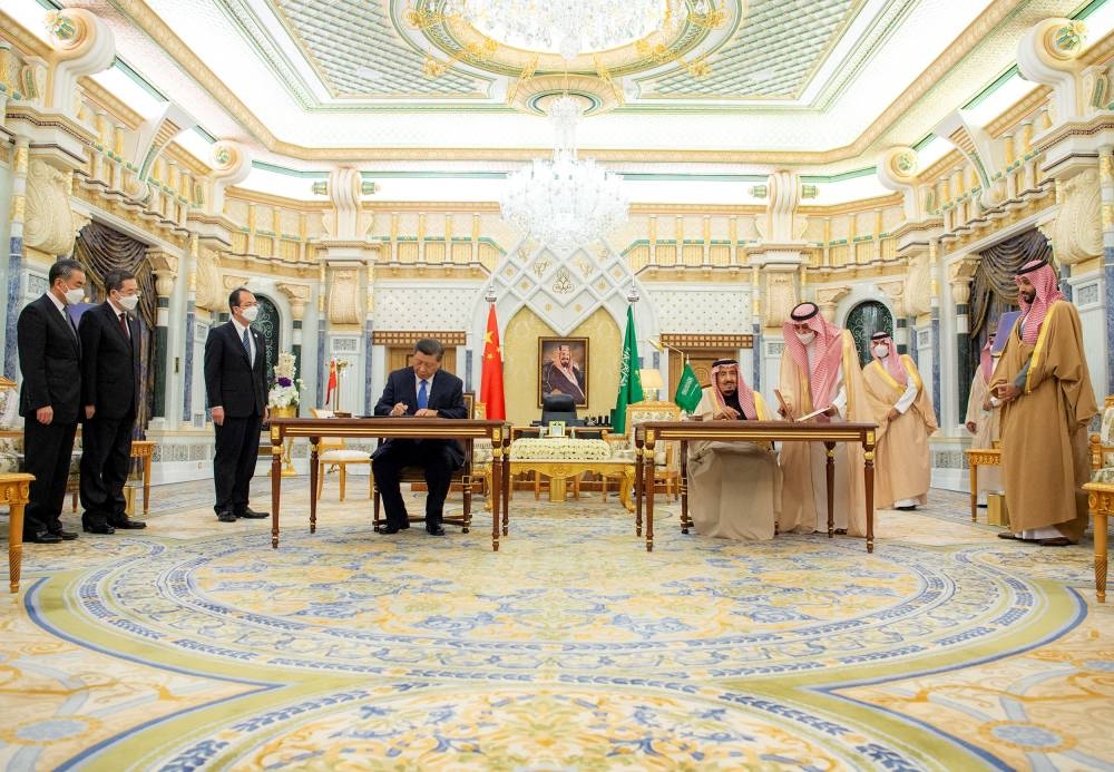 Saudi King Salman bin Abdulaziz and Chinese President Xi Jinping sign documents during a meeting in Riyadh, Saudi Arabia December 8, 2022. ― Reuters pic