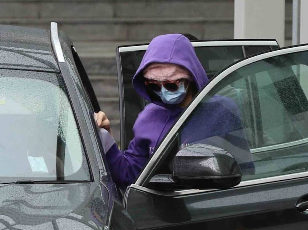 Tan Lee Hoon about to leave the State Courts in a car in Singapore December 9, 2022. Tan was granted bail pending her sentencing scheduled for January 12, 2023. — TODAY pic