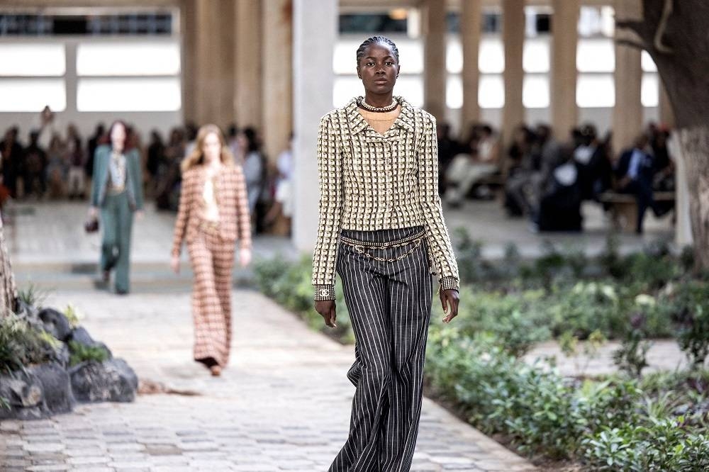 A model walks down the catwalk during the luxury brand Chanel’s fashion show, Metiers d’art, in Dakar on December 6, 2022. — AFP pic