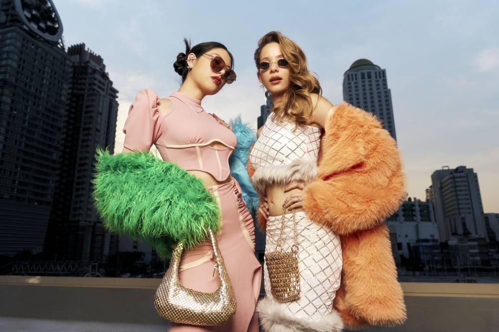 For an ensemble that looks and feels luxurious, take a coat with faux fur trim and layer it with a fitted dress or top and skirt. — Picture courtesy of SHEIN