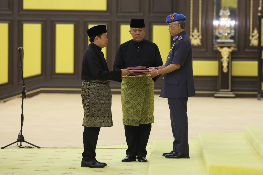 Umno secretary-general Datuk Seri Ahmad Maslan is sworn in as the Deputy Minister of Finance before the Yang di-Pertuan Agong Al- Sultan Abdullah Ri’ayatuddin Al-Mustafa Billah Shah at Istana Negara December 10, 2022. — Bernama pic