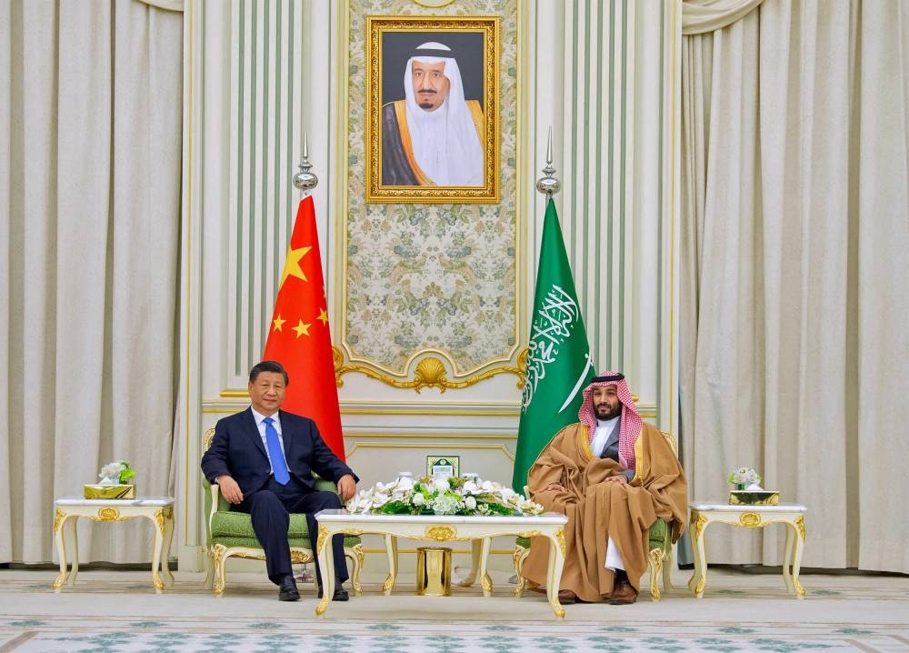 This handout picture provided by the Saudi Royal Palace shows Saudi Crown Prince Mohammed bin Salman (right) welcoming Chinese President Xi Jinping during a ceremony in the capital Riyadh, on December 8, 2022. — AFP pic