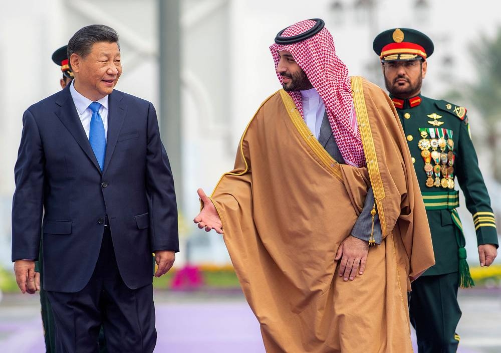 This handout picture provided by the Saudi Royal Palace shows Saudi Crown Prince Mohammed bin Salman (right) welcoming Chinese President Xi Jinping during a ceremony in the capital Riyadh, on December 8, 2022. — AFP pic