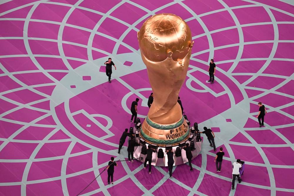 A giant replica of the world cup trophy is displayed on the pitch before the start of the Qatar 2022 World Cup quarter-final football match between The Netherlands and Argentina at Lusail Stadium, north of Doha on December 9, 2022. — AFP pic