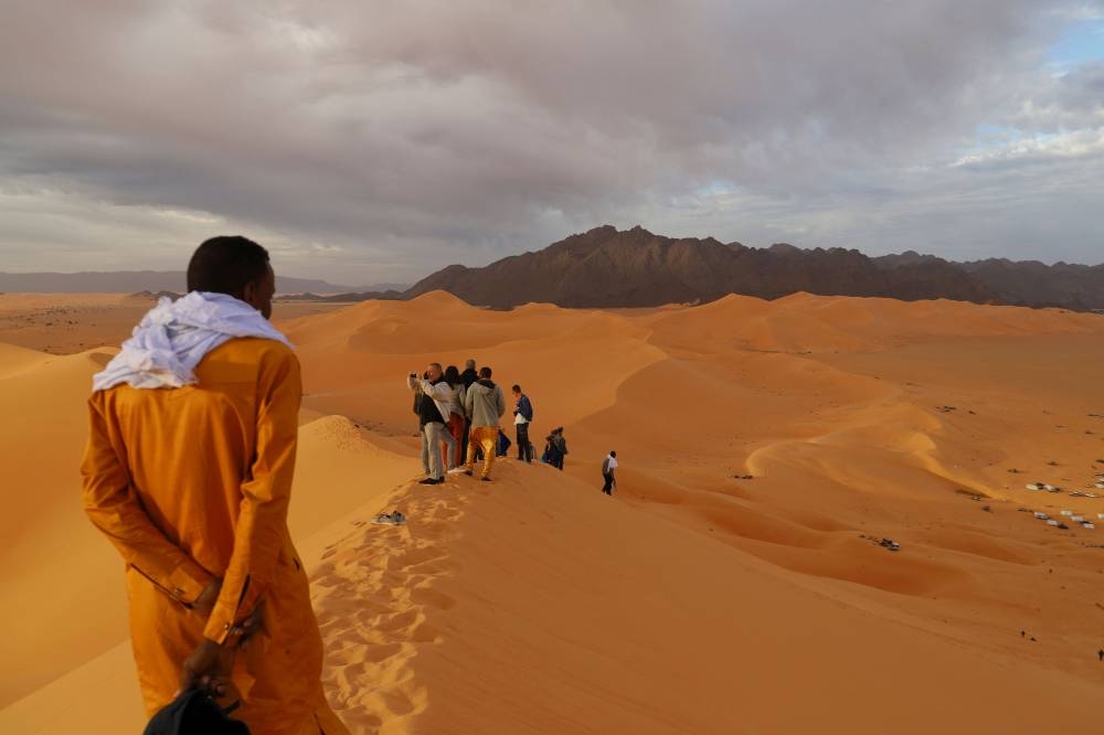 Tourists are seen on December 3, 2022, on the Chiriet dunes, north-east of Iferouane at the beginning of the Tenere portion of the Sahara desert. — AFP pic 