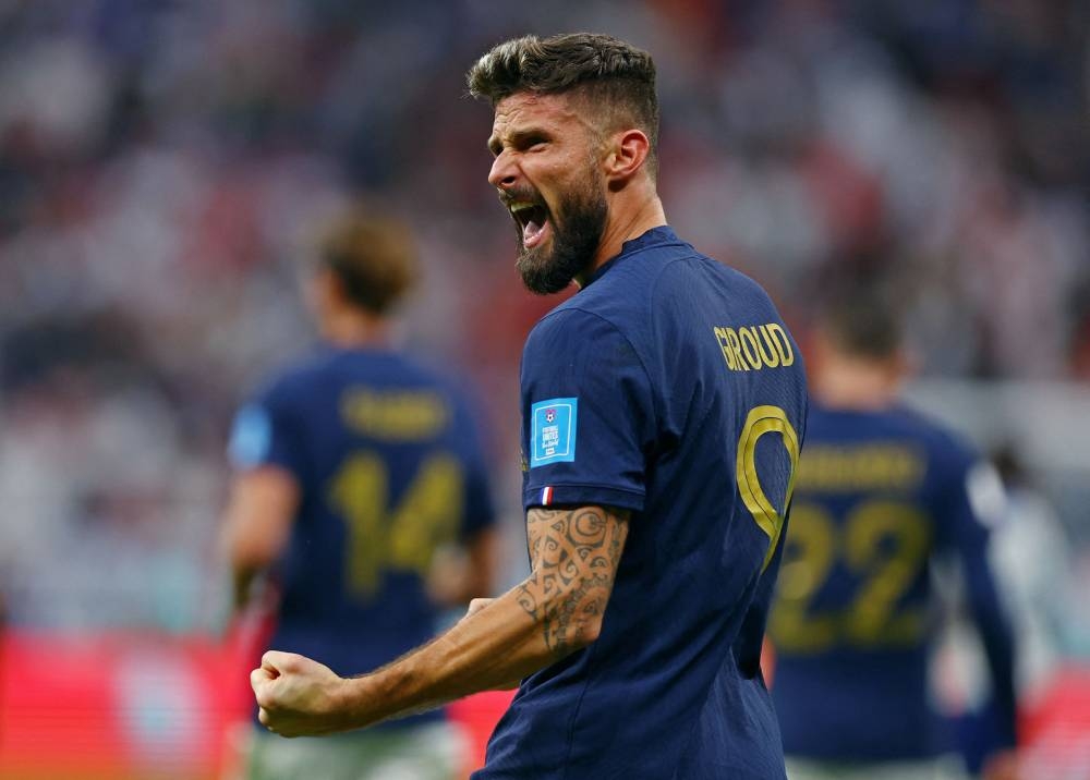 France's Olivier Giroud celebrates scoring their second goal against England at the Al Bayt Stadium, Al Khor December 10, 2022. — Reuters pic