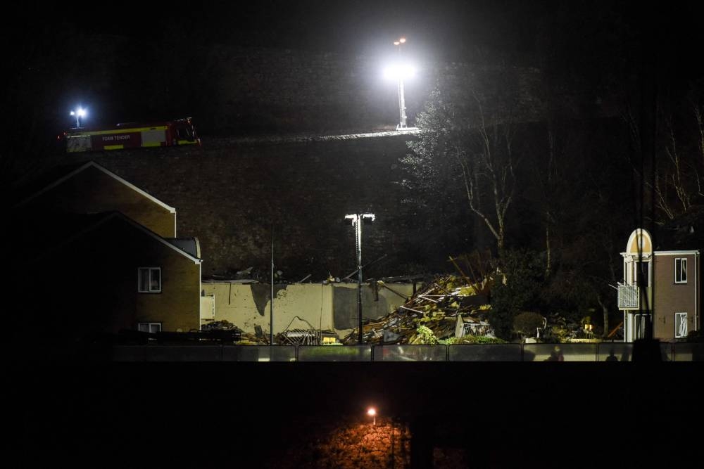 This picture taken on December 10, 2022 shows the rubble of a low-rise apartment block after an explosion in Saint-Helier, Jersey Island, killing three people and several others are missing, authorities said. — AFP pic