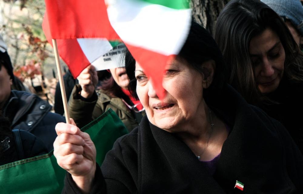 A woman joins protestors as they gather outside of an Iranian diplomat's residence to denounce the Iranian government and the recent execution of a protester, in New York December 10, 2022. — Getty Images via AFP