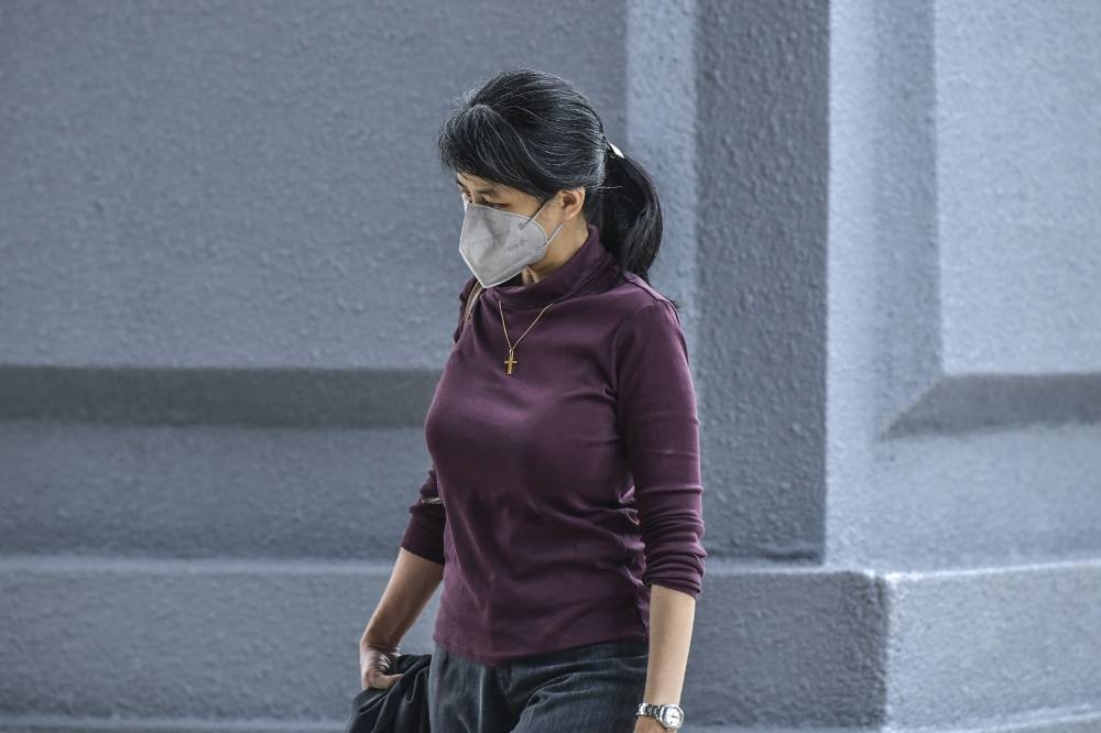 Former AmBank banker Joanna Yu arrives at Kuala Lumpur High Court December 12, 2022. — Picture by Hari Anggara