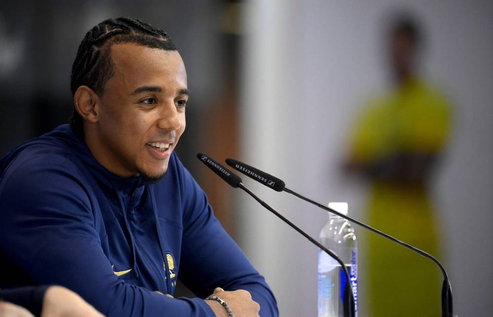 France's defender Jules Kounde gives a press conference at the Jassim-bin-Hamad Stadium in Doha on December 12, 2022, in the build-up to the Qatar 2022 World Cup semi final football match between France and Morocco. — AFP pic
