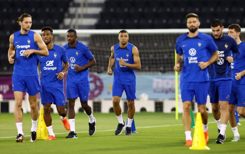 France's Kylian Mbappe with teammates during training at the Al Sadd SC Stadium, Doha December 12, 2022. — Reuters pic