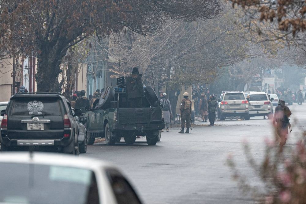 Taliban security forces arrive at the site of an attack at Shahr-e-naw which is city's one of main commercial areas in Kabul on December 12, 2022. — AFP pic
