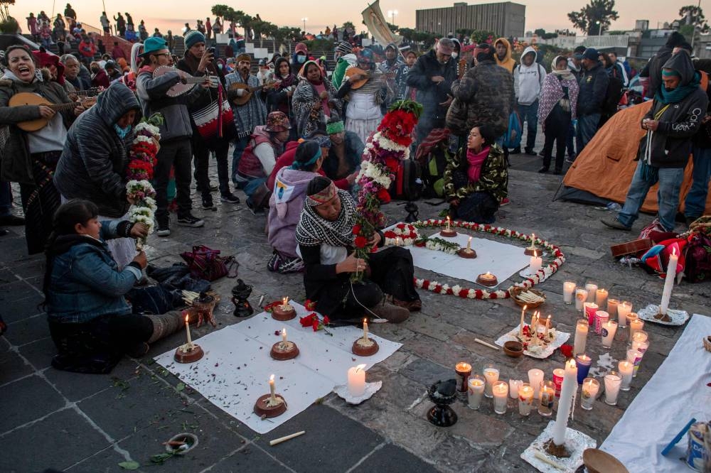 Pilgrims sing songs outside the Basilica of Guadalupe in Mexico City December 12, 2022.— AFP pic