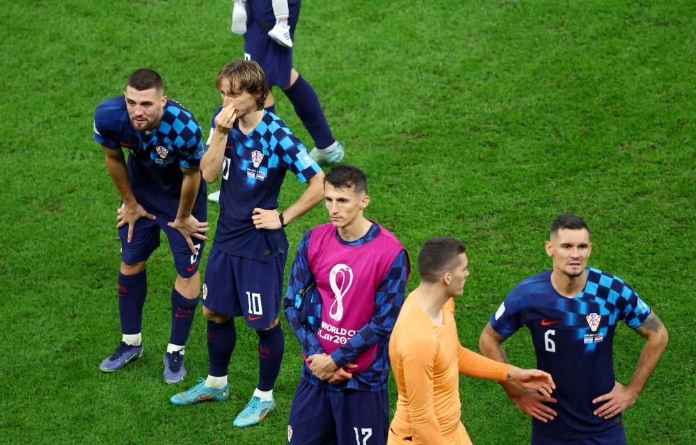 Croatia's Mateo Kovacic, Luka Modric, Ante Budimir, Dominik Livakovic and Dejan Lovren look dejected after being eliminated from the World Cup at the Lusail Stadium, Lusail December 13, 2022. — Reuters pic
