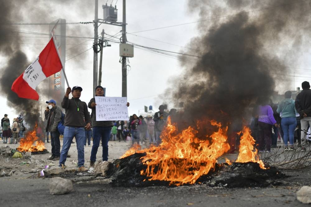 Protestors take over the Pan-American highway in the Northern Cone of Arequipa, Peru December 12, 2022. — AFP pic