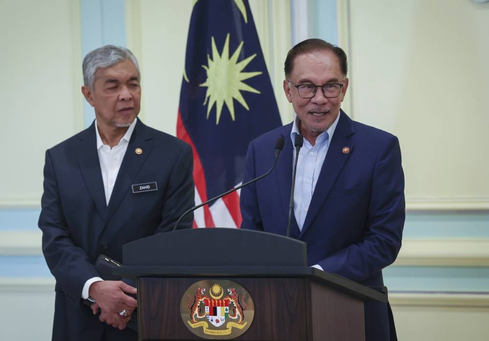 Prime Minister Datuk Seri Anwar Ibrahim speaks during a press conference in Putrajaya December 14, 2022. — Bernama pic