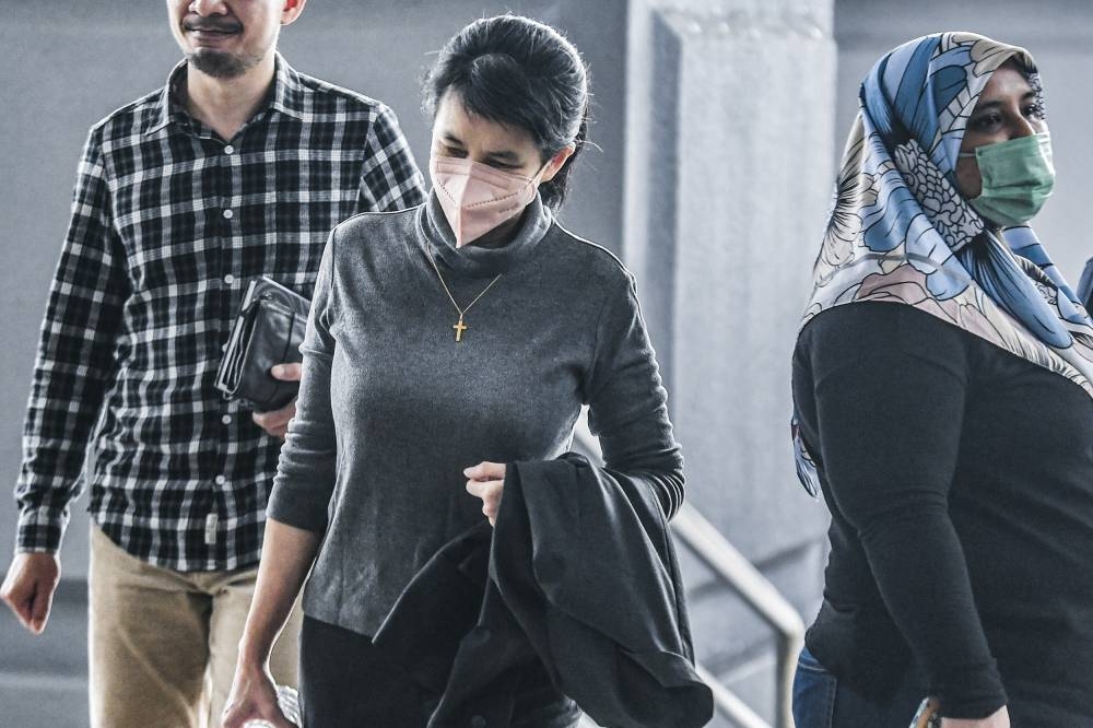Former AmBank banker Joanna Yu arrives at Kuala Lumpur High Court, December 14, 2022. — Picture by Hari Anggara