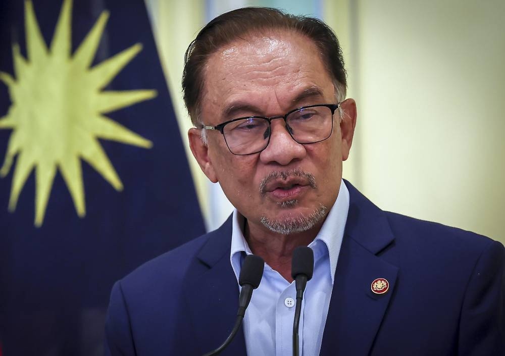 Prime Minister Datuk Seri Anwar Ibrahim speaks during a press conference in Putrajaya December 14, 2022. — Bernama pic