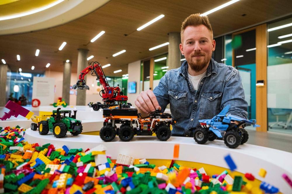 Lego designer Samuel Tacchi from France, 34, shows a few designs at the Lego campus in Billund, Denmark on November 29, 2022. — AFP pic