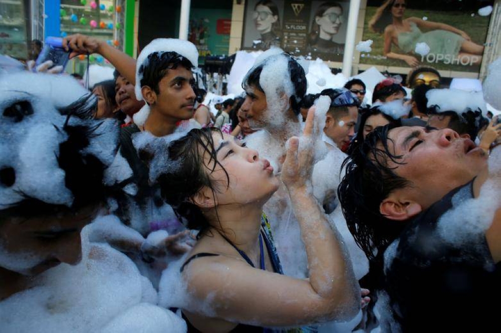 Revellers react at a foam party during Songkran Festival celebrations in Bangkok, Thailand April 13, 2017. — Reuters file pic