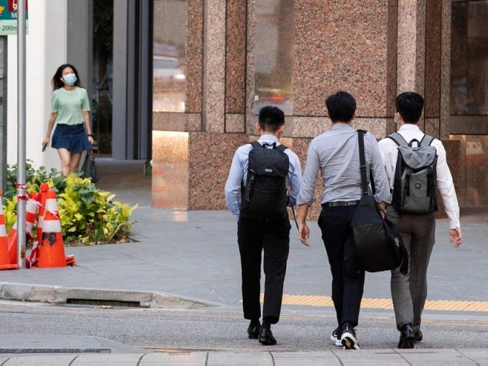 Office workers walking in the Central Business District of Singapore. ― TODAY pic