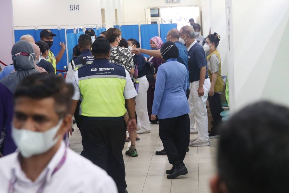 Batang Kali landslide victims’ family members are seen at the Sungai Buloh Hospital December 16, 2022. — Picture by Choo Choy May 
