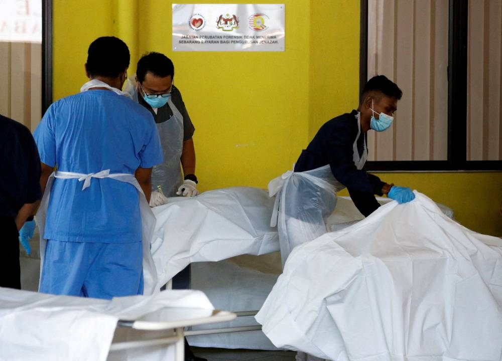 The dead bodies of Batang Kali landslide victims are seen at Kuala Lumpur Hospital’s mortuary in Kuala Lumpur, December 16, 2022. — Reuters pic 