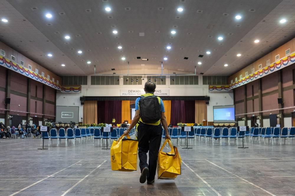 The ballot boxes arrived at the Election Commission counting centre at Politeknik Tuanku Syed Sirajuddin, November 19, 2022. — Picture by Shafwan Zaidon