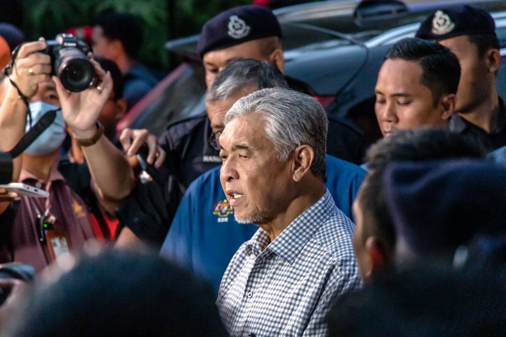 Deputy Prime Minister and Rural and Regional Development Minister Datuk Seri Ahmad Zahid Hamidi speaks to the media at the site of the landslide at Father’s Organic Farm Batang Kali, December 16, 2022. — Picture by Firdaus Latif