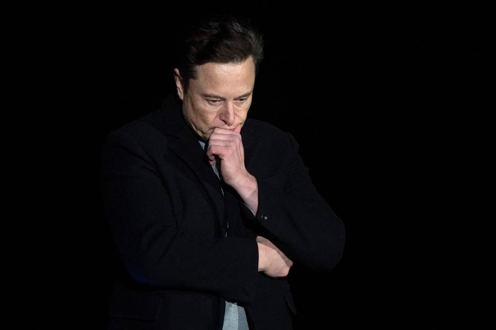 In this file photo taken on February 10, 2022 Elon Musk pauses and looks down as he speaks during a press conference at SpaceX’s Starbase facility near Boca Chica Village in South Texas. — AFP pic