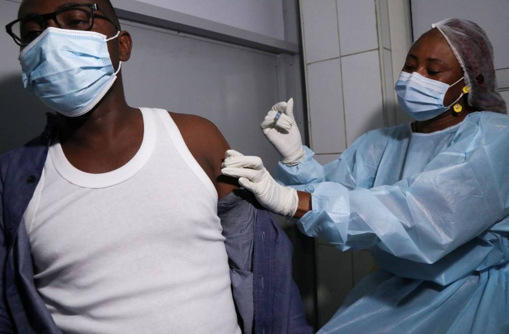 A health worker receives a vaccine against Ebola at a hospital after a case of Ebola was confirmed in Abidjan, Ivory Coast August 16, 2021. — Reuters pic